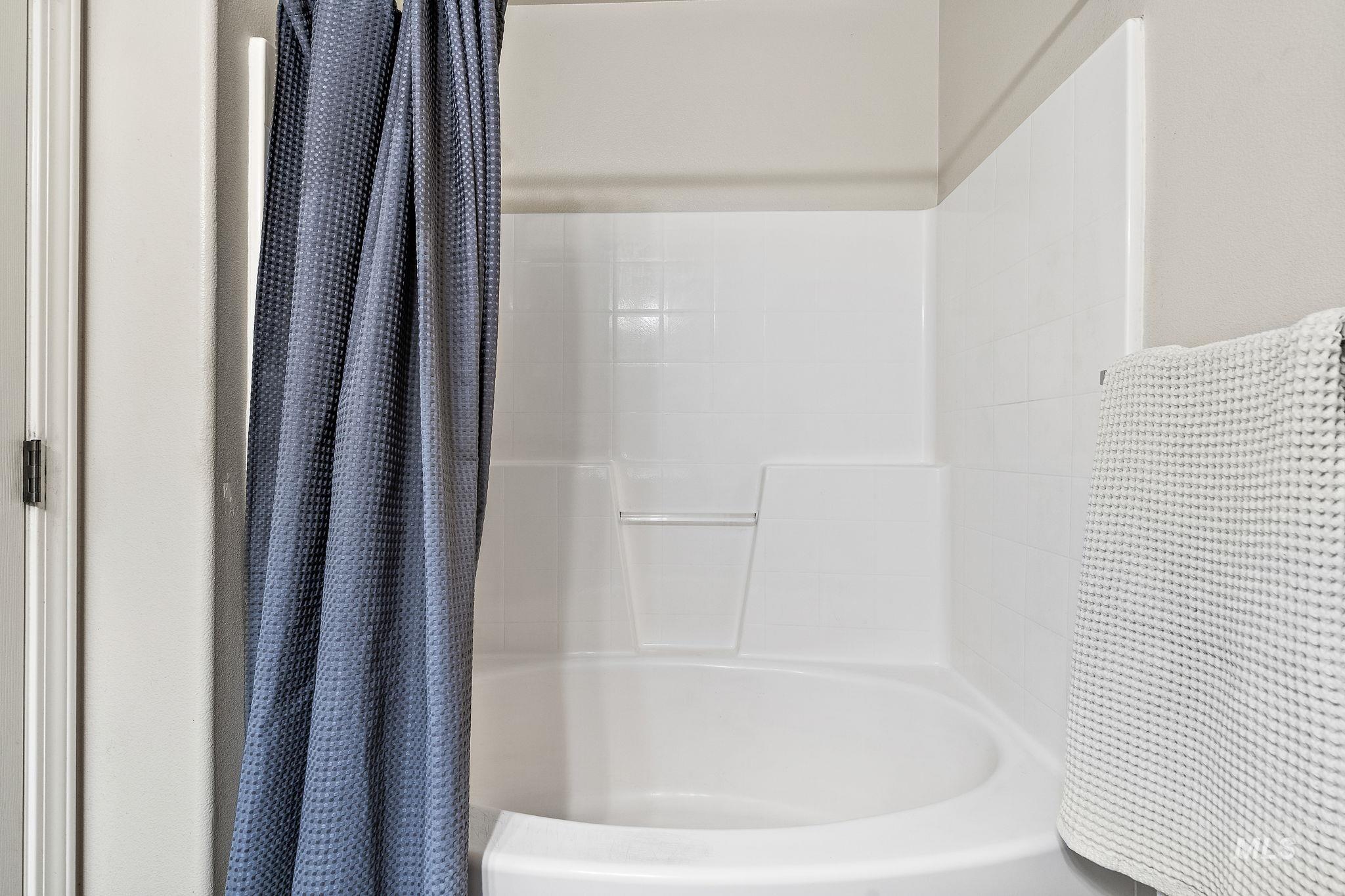 Full bathroom with shower / bath combo