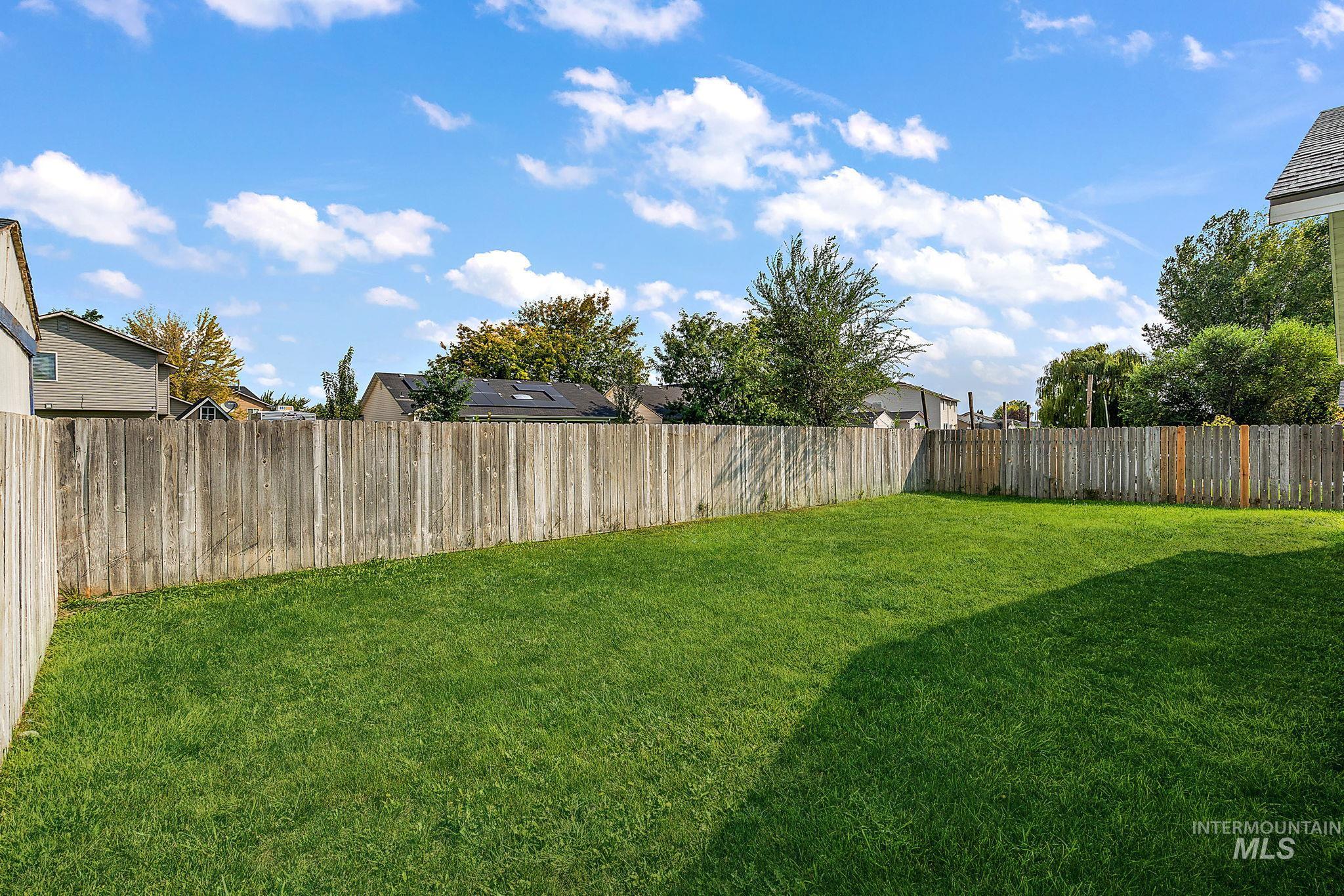View of fenced backyard