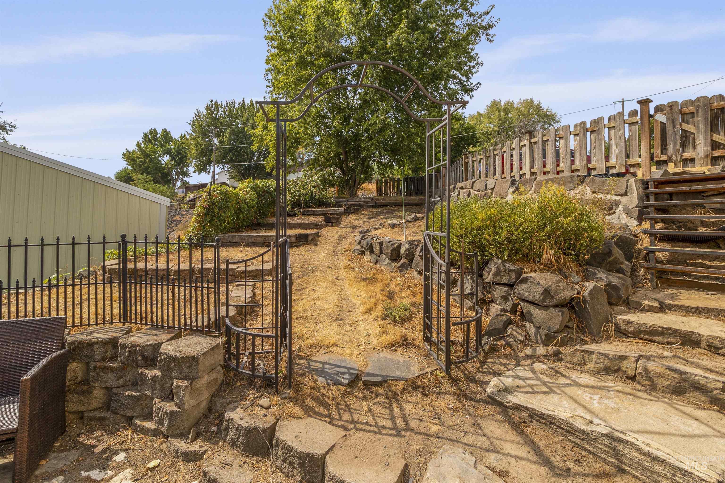 View of yard featuring a gate