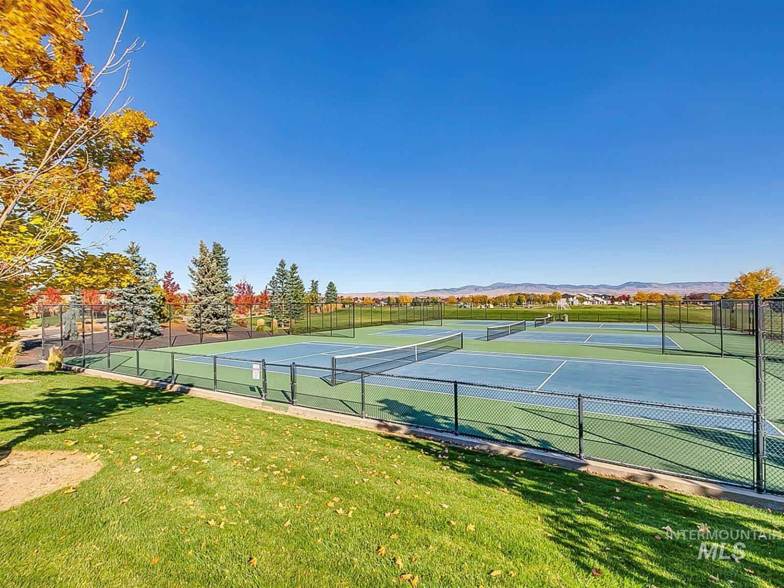 View of tennis court featuring a mountain view