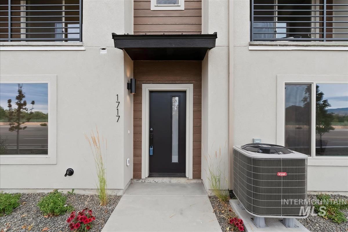 Property entrance with stucco siding