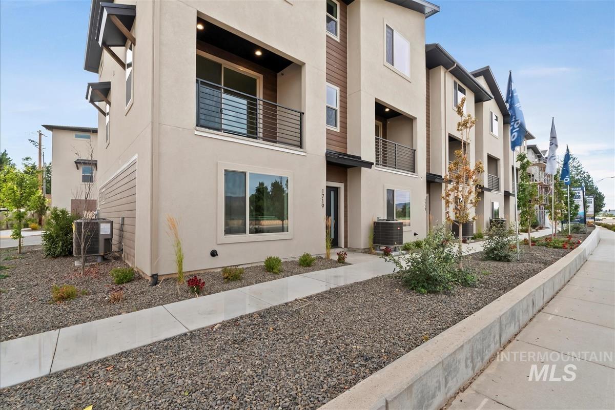 View of property with a residential view