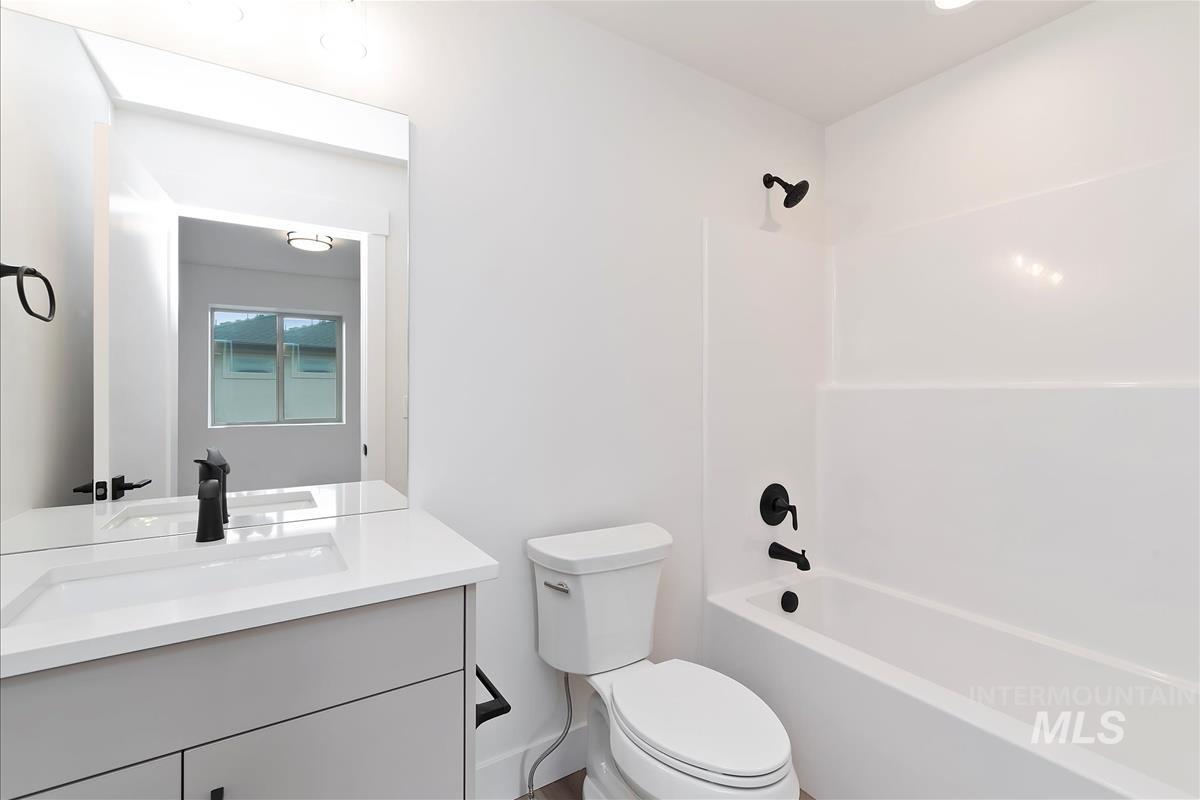 Full bathroom with bathing tub / shower combination and vanity