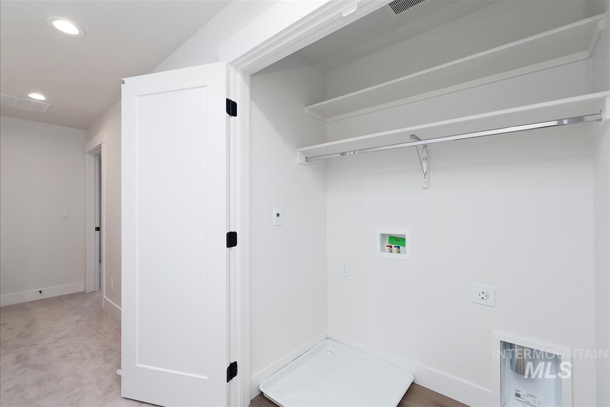 Laundry room with recessed lighting, washer hookup, carpet floors, and electric dryer hookup