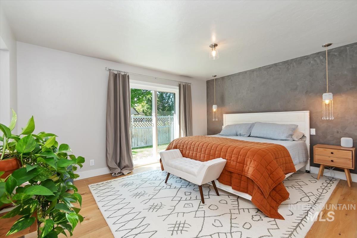 Bedroom featuring access to outside and light wood-style floors