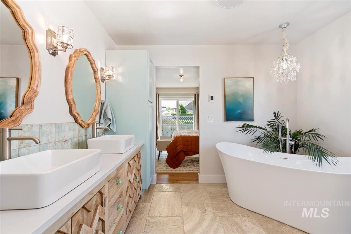 Ensuite bathroom with double vanity and a freestanding bath
