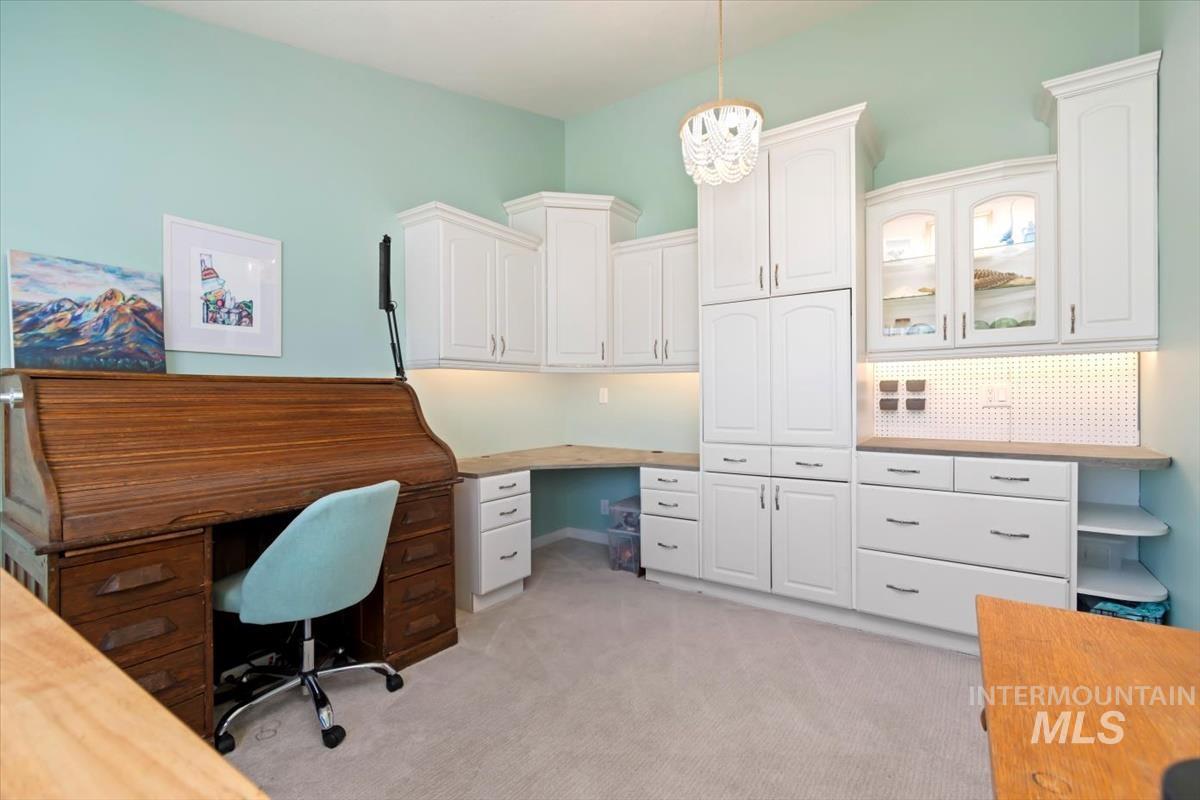 Office space with light colored carpet