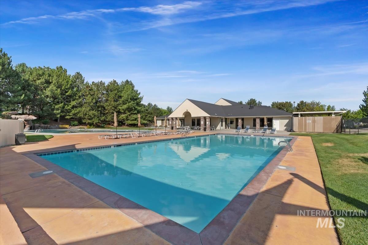 Community pool featuring a patio area