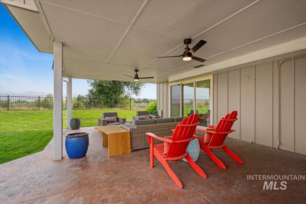 View of patio featuring a ceiling fan and outdoor lounge area