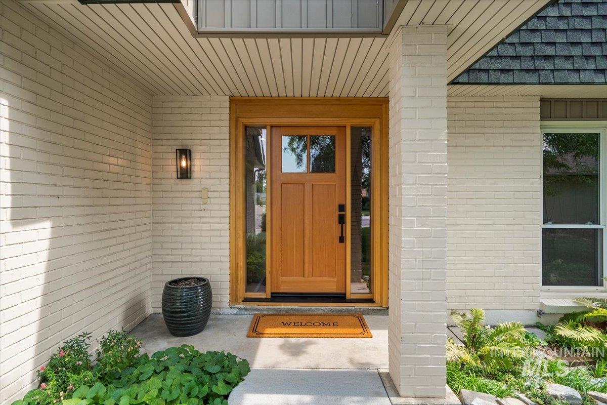 Property entrance with brick siding