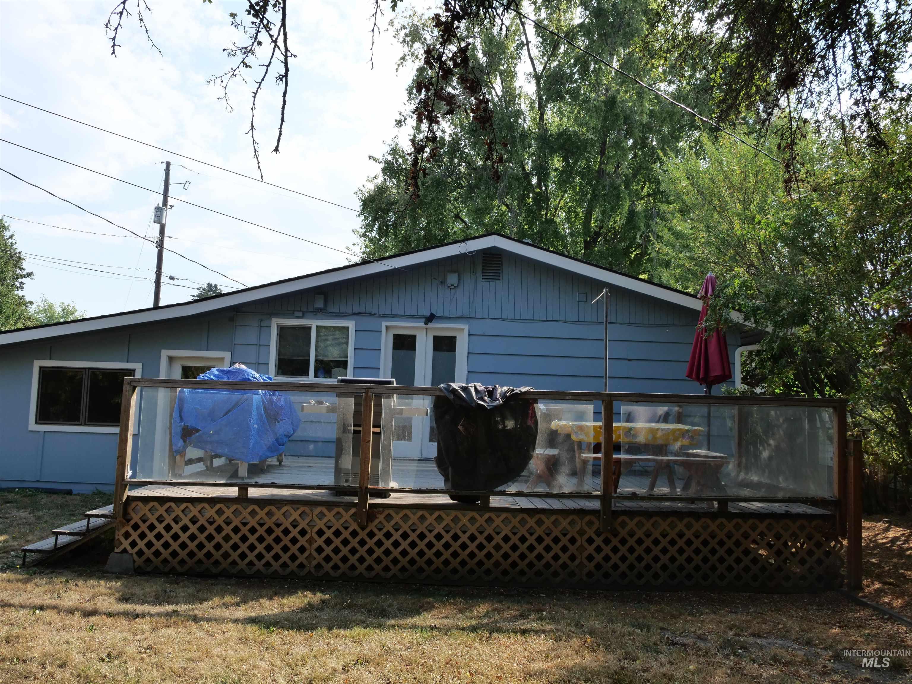 Rear view of property with a deck