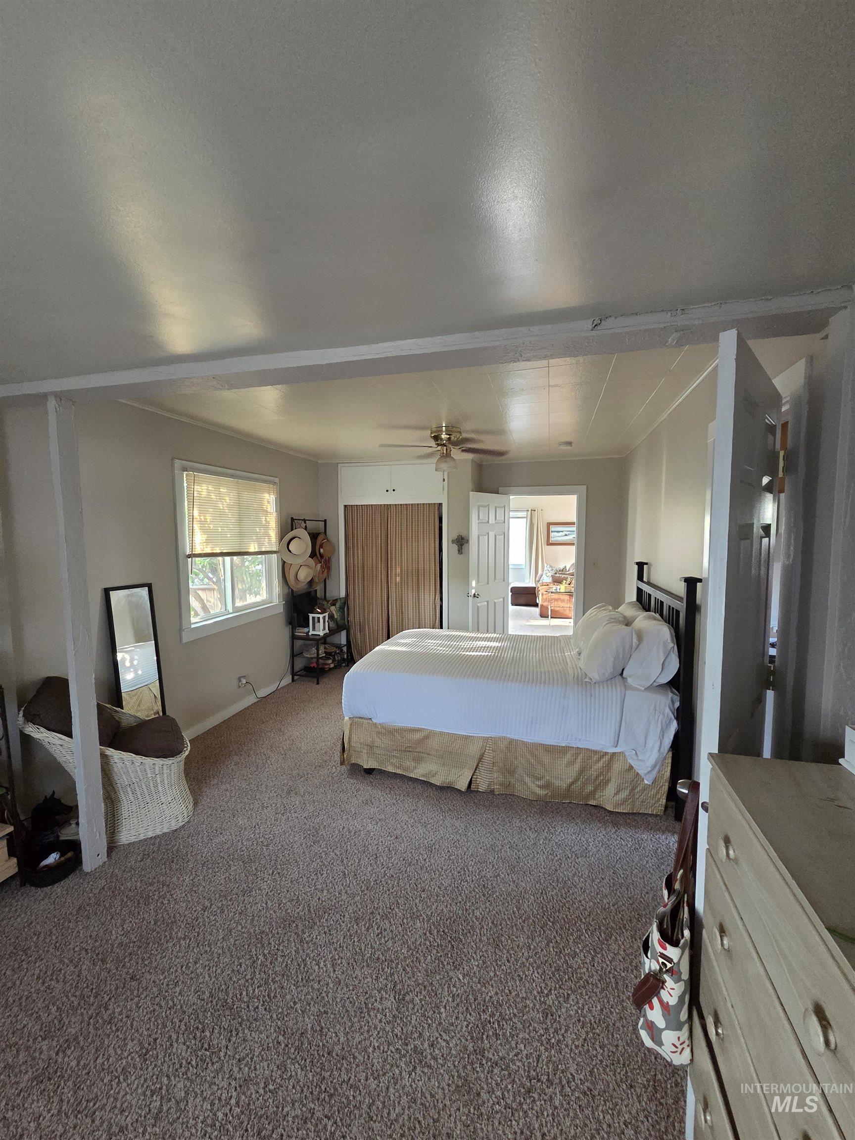 Carpeted bedroom with baseboards