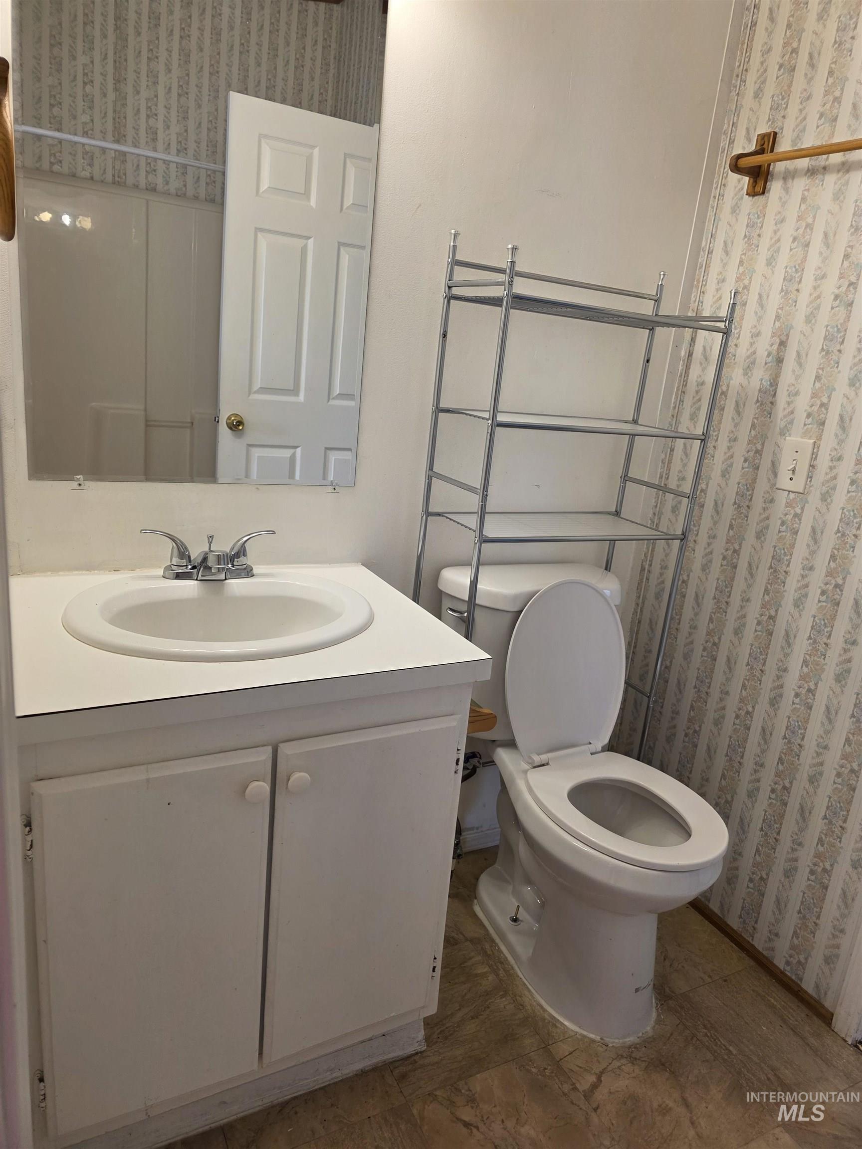 Bathroom with vanity and toilet