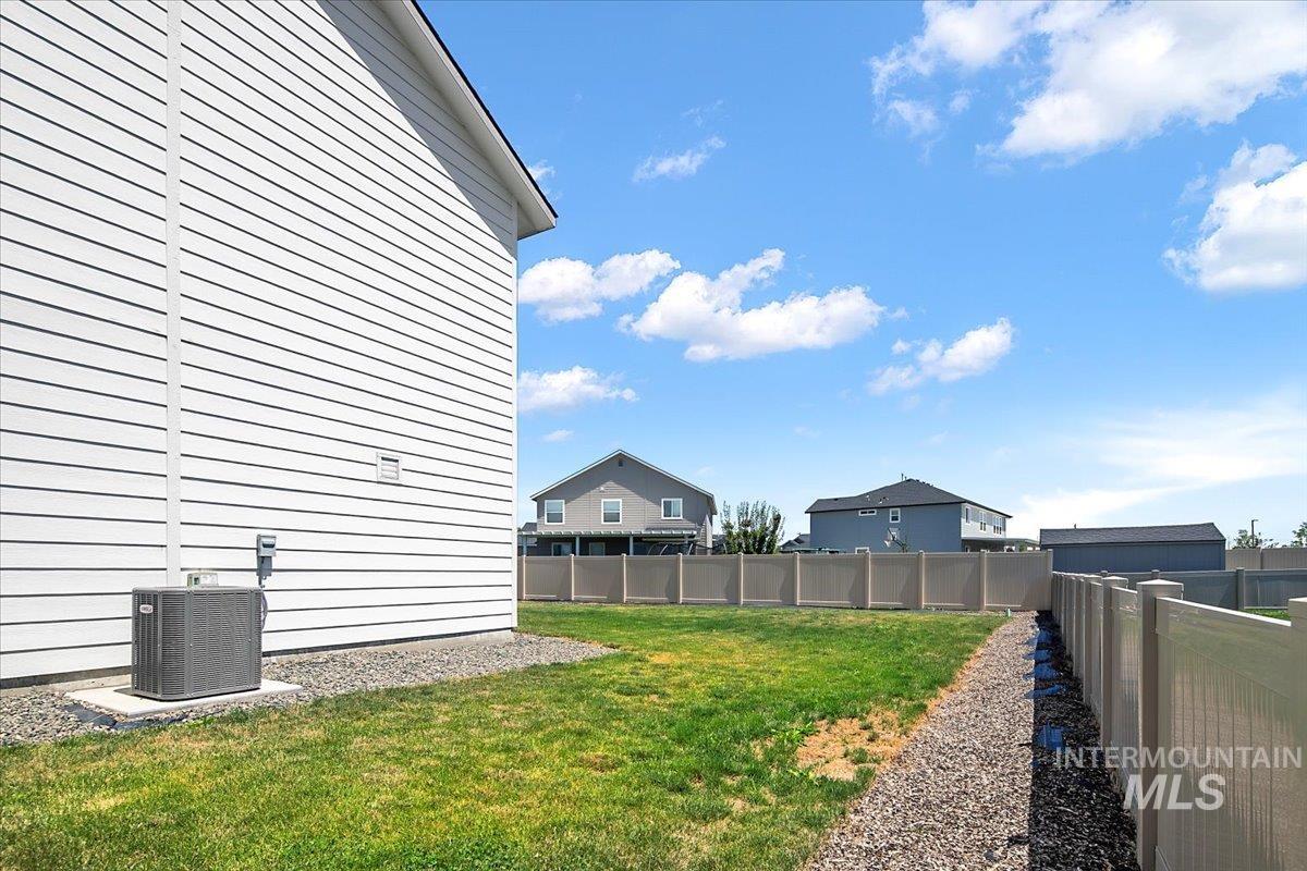 View of fenced backyard