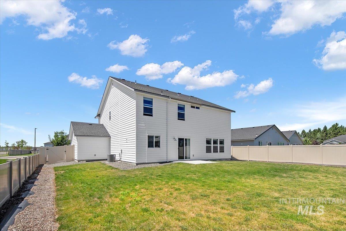 Back of house featuring a patio area and a fenced backyard