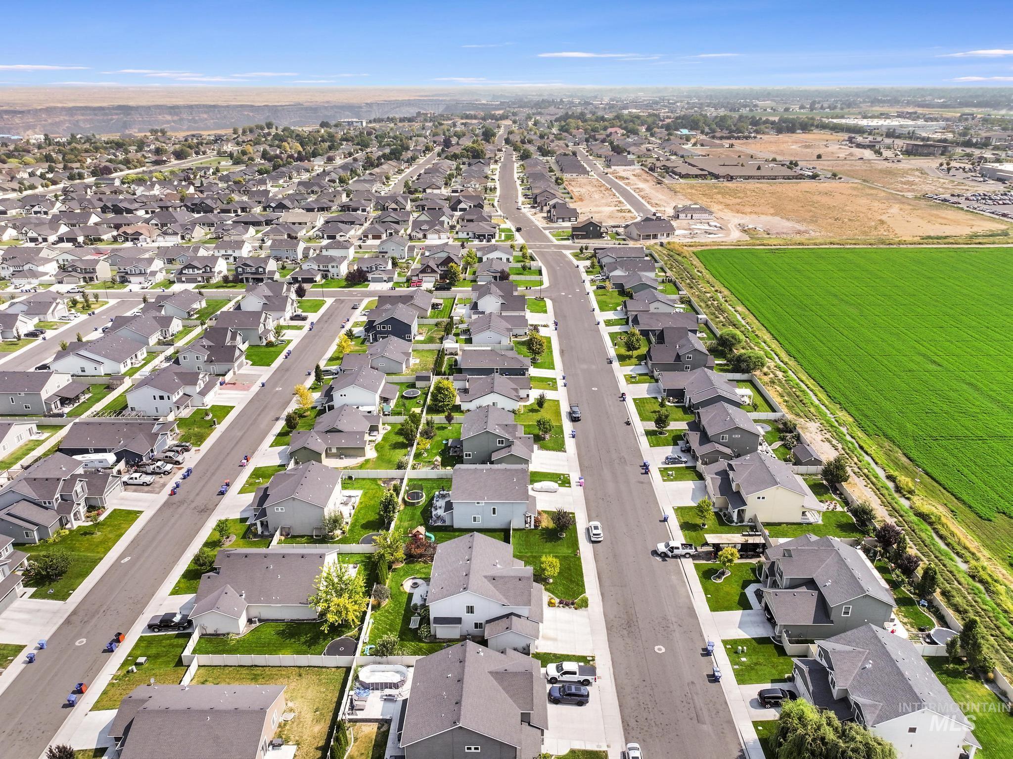 View of property location with nearby suburban area