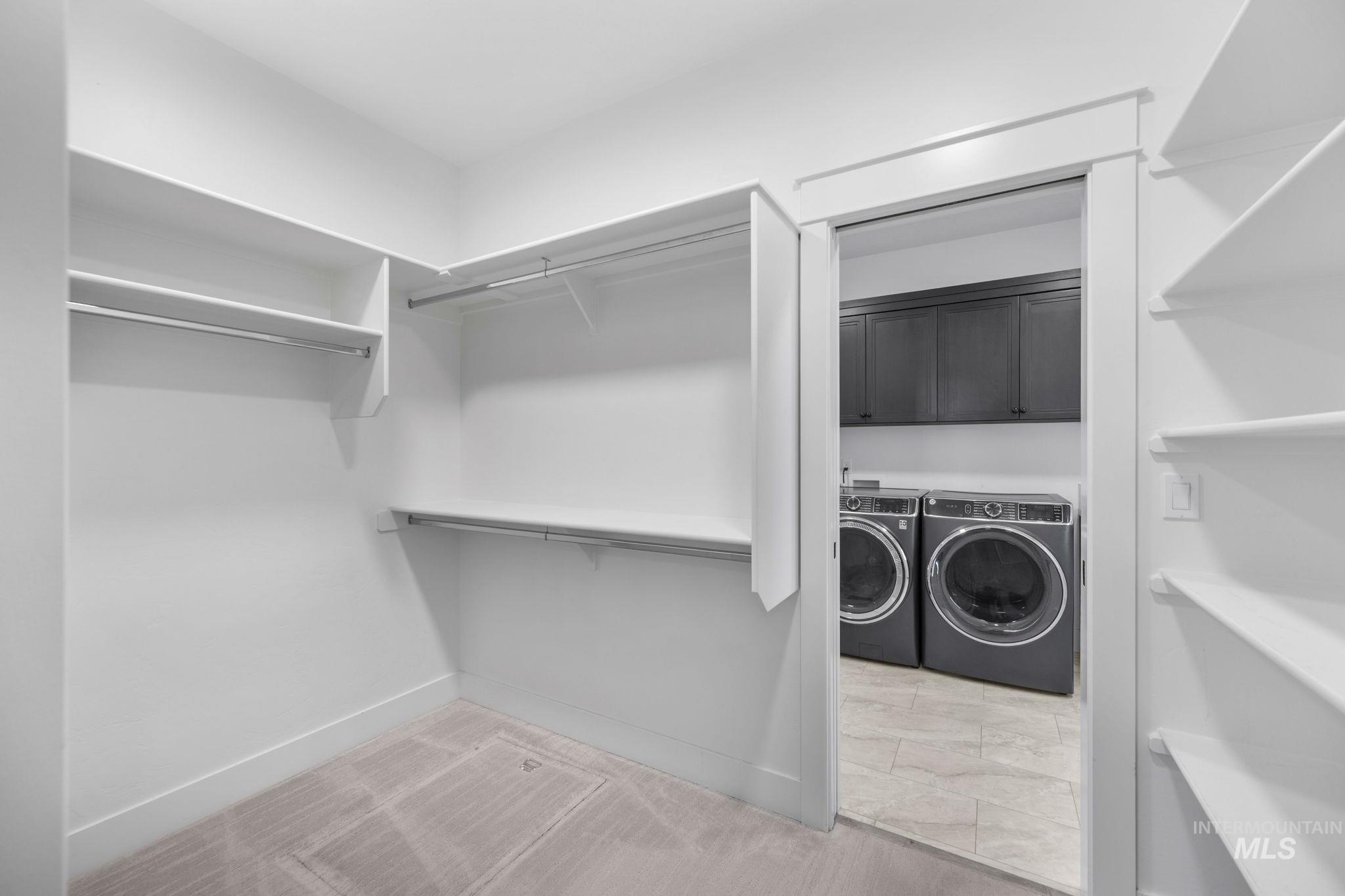 Spacious closet with separate access to the laundry room.