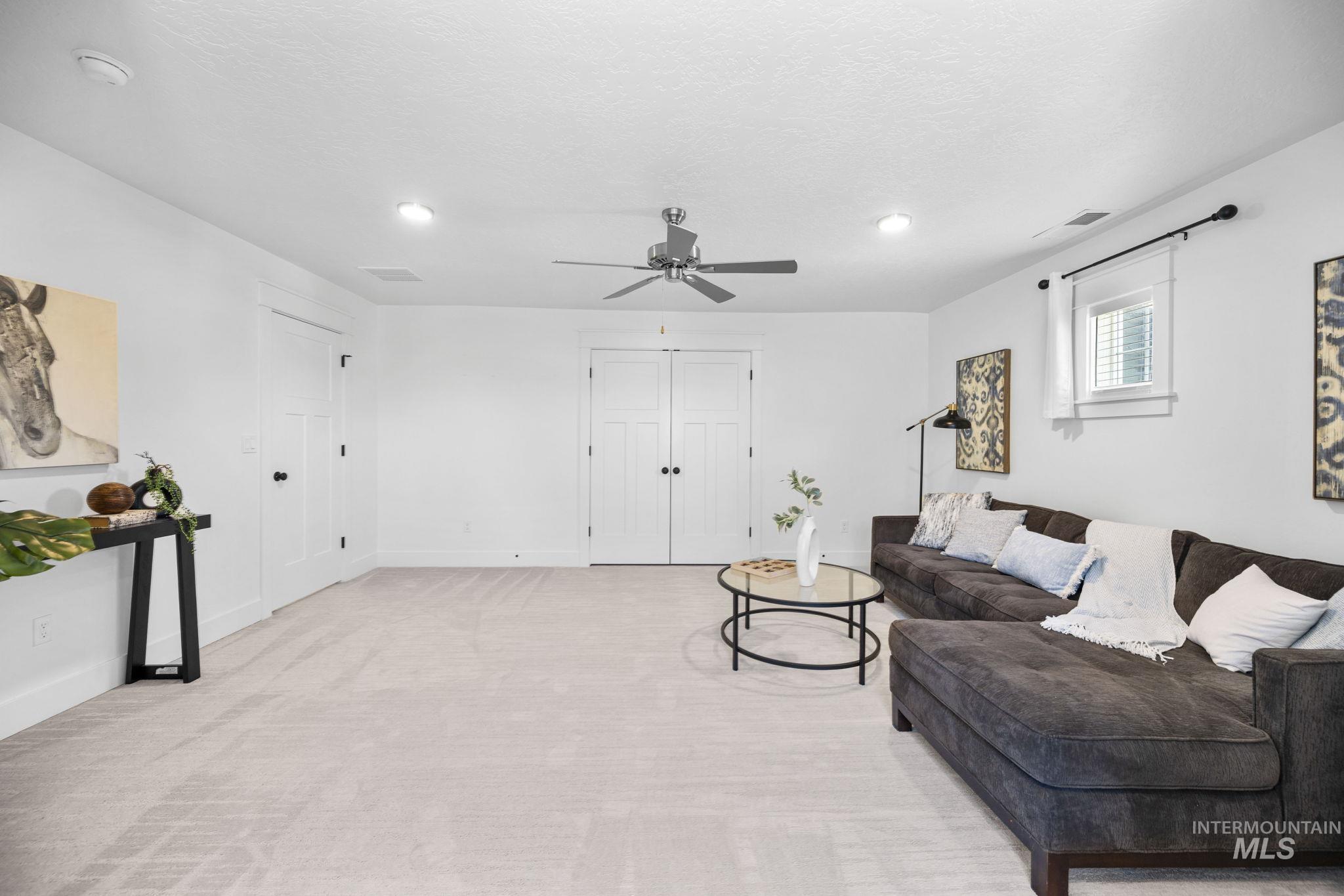 Upstairs Bonus Room featuring carpet flooring, ceiling fan, a textured ceiling, and recessed lighting