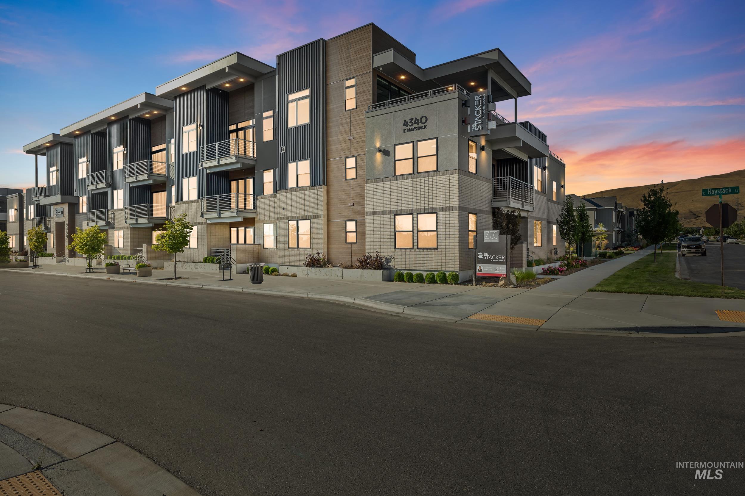 Property at dusk featuring a residential view
