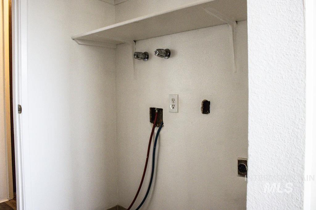 Laundry area featuring washer hookup and electric dryer hookup