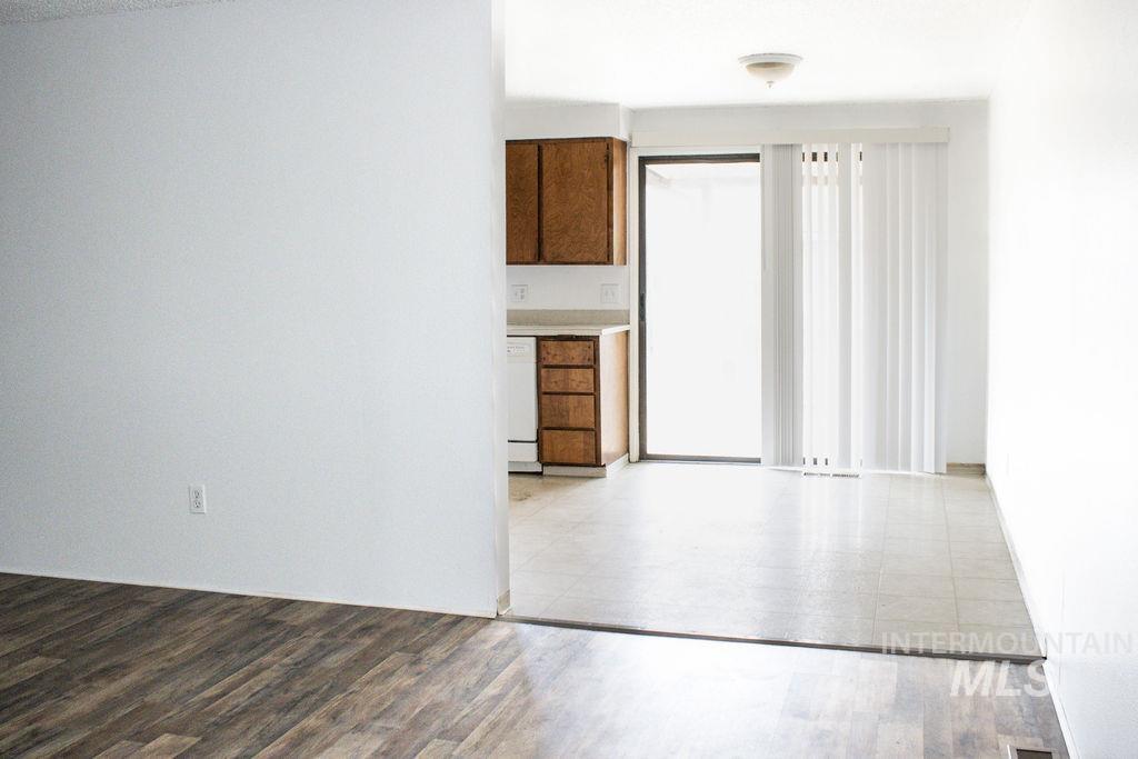 Empty room with light wood finished floors