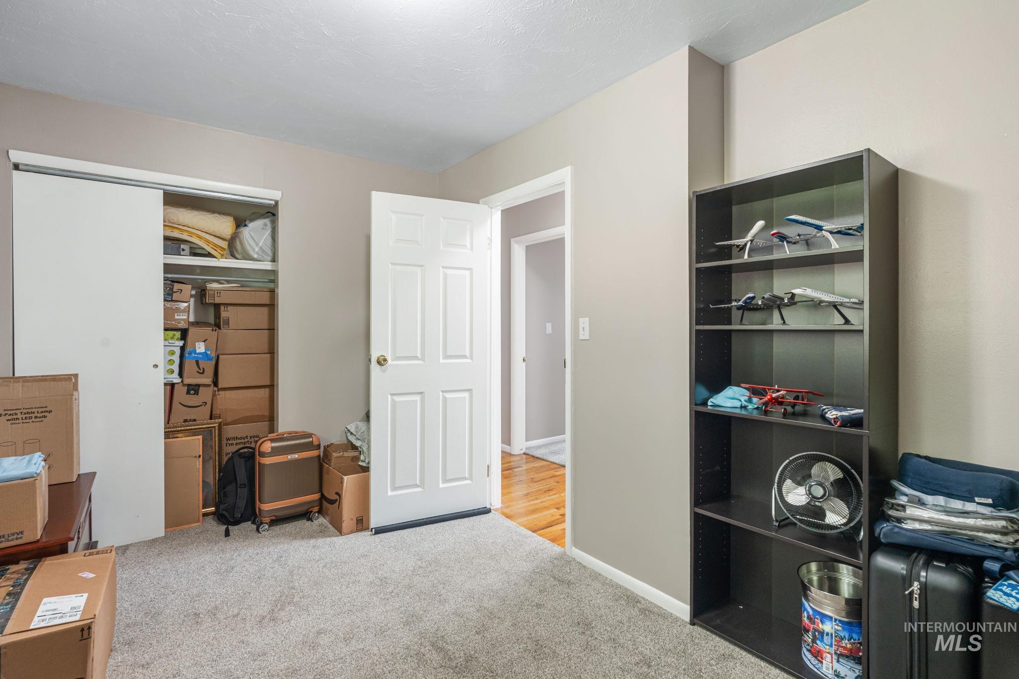 Office space with light carpet and baseboards