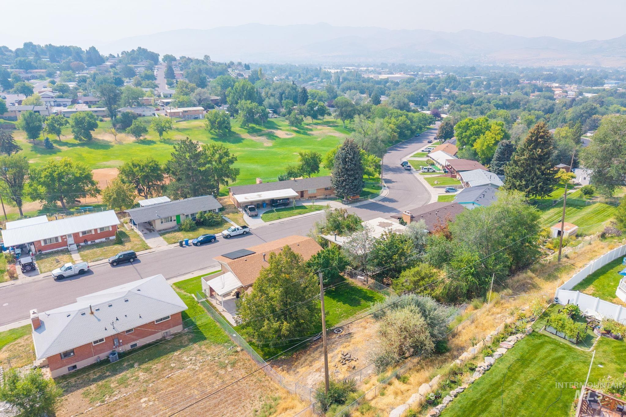 Aerial view of residential area featuring mountains