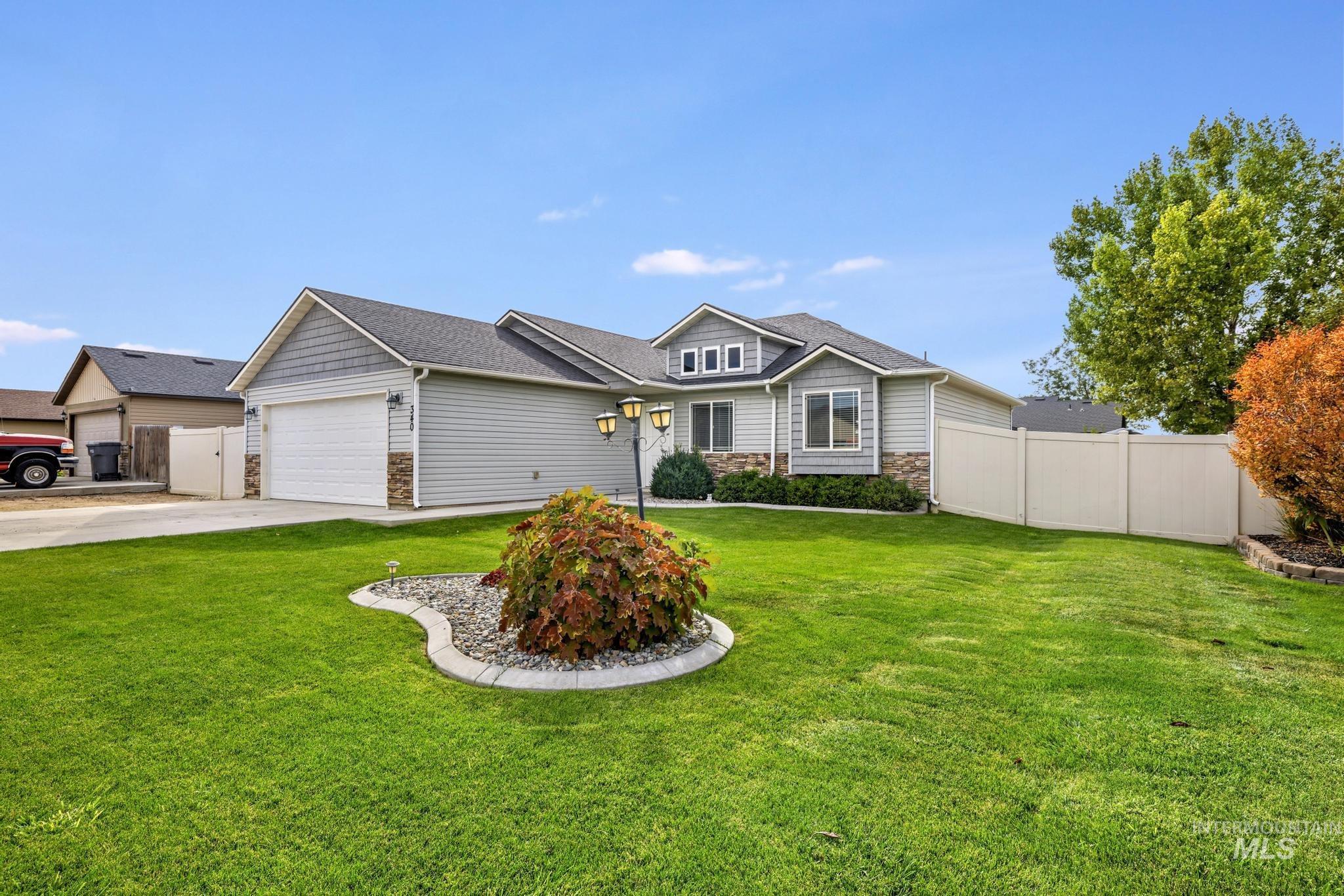 Craftsman-style home with stone siding, concrete driveway, a garage, and a shingled roof