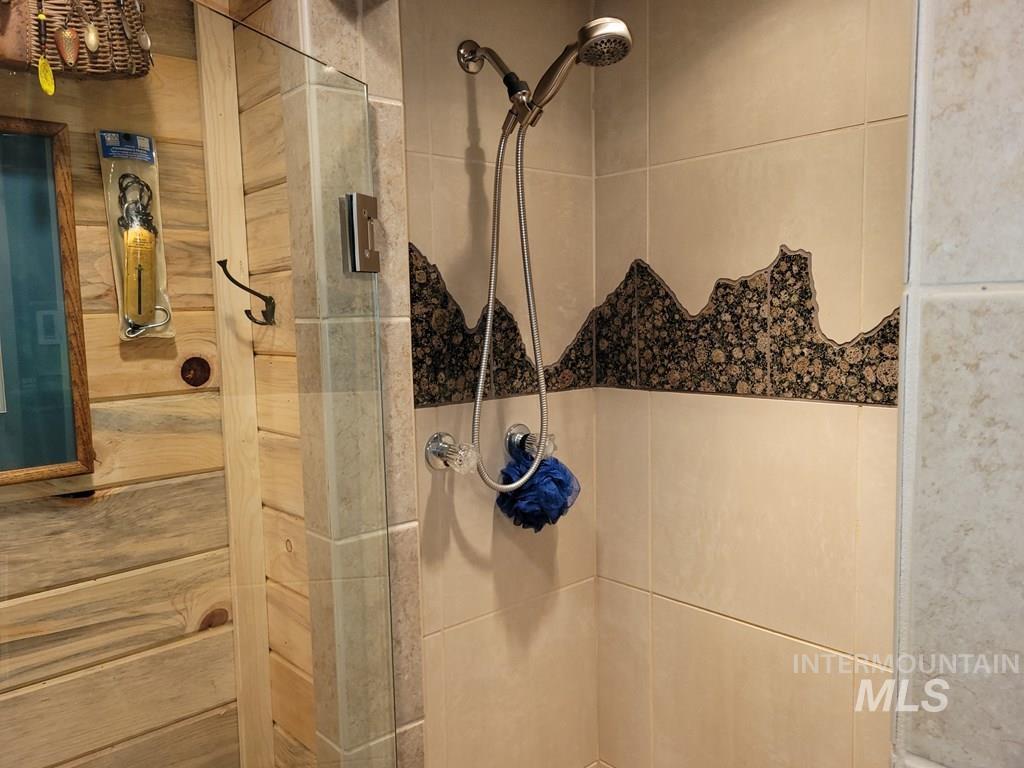 Full bath with a shower stall
