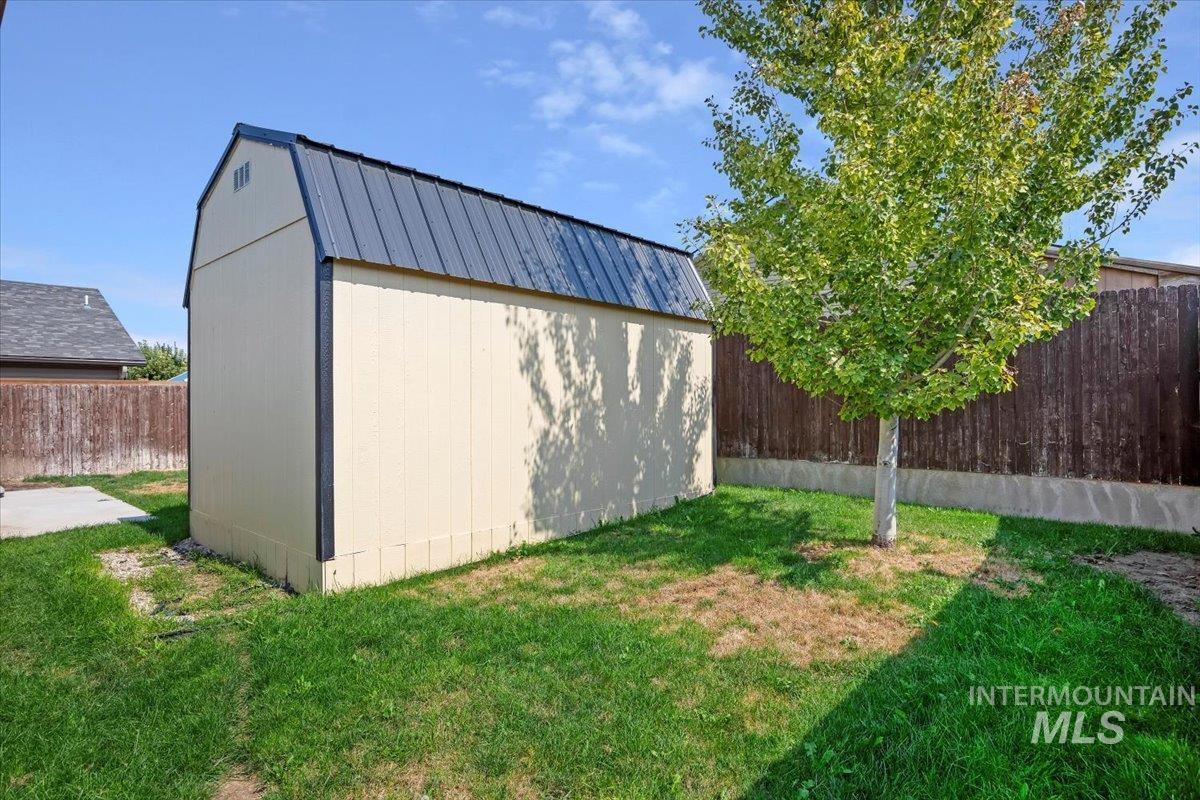 View of shed featuring a fenced backyard