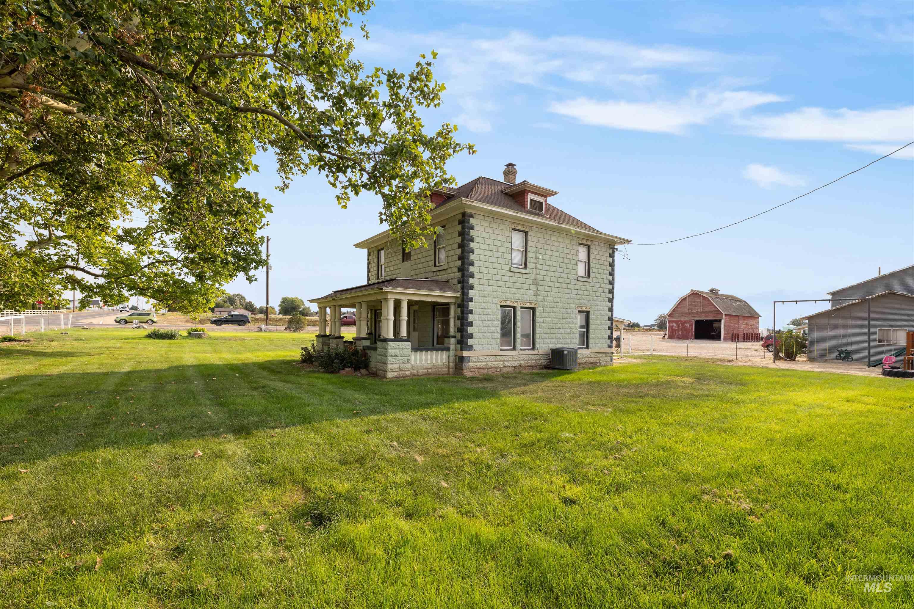 Back of property featuring a chimney