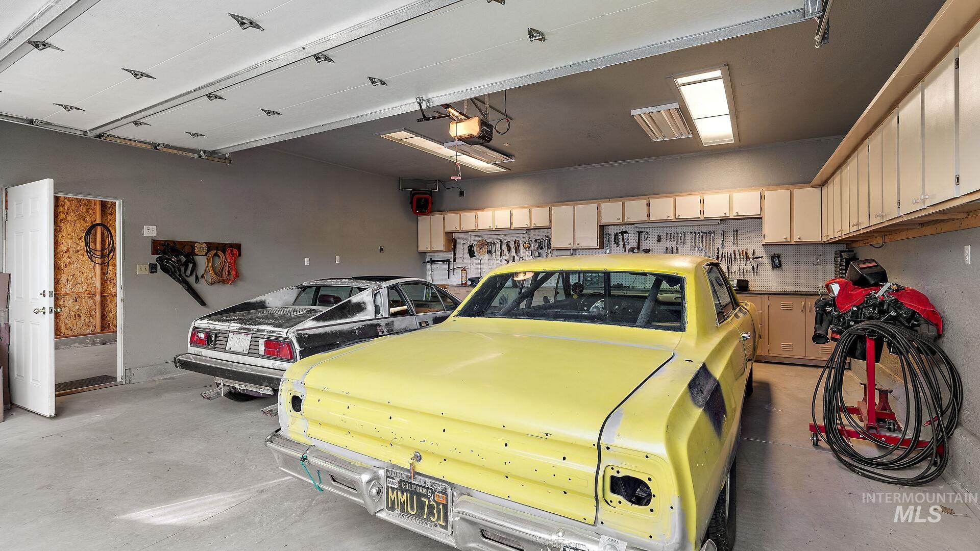 Garage featuring a garage door opener