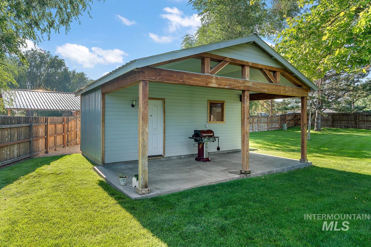 View of outbuilding featuring a fenced backyard