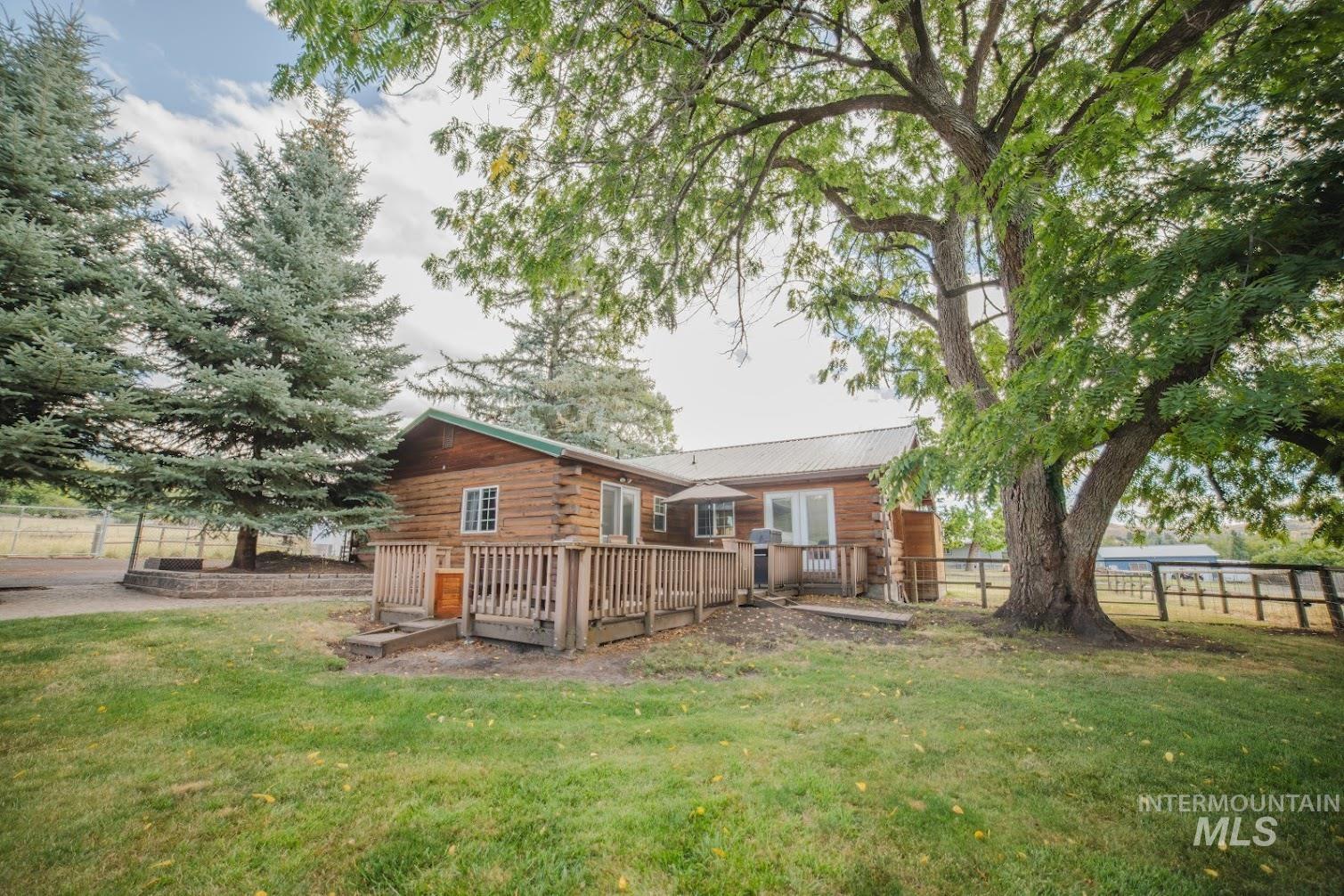 Rear view of property with a wooden deck