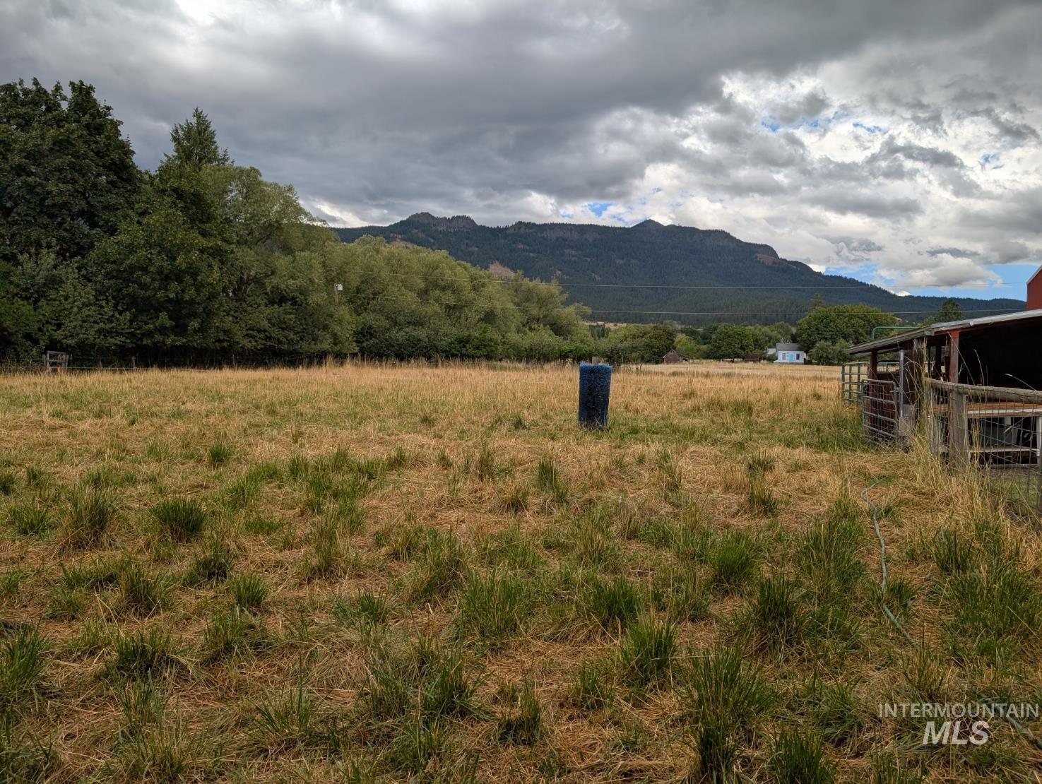 View of mountain backdrop featuring rural landscape