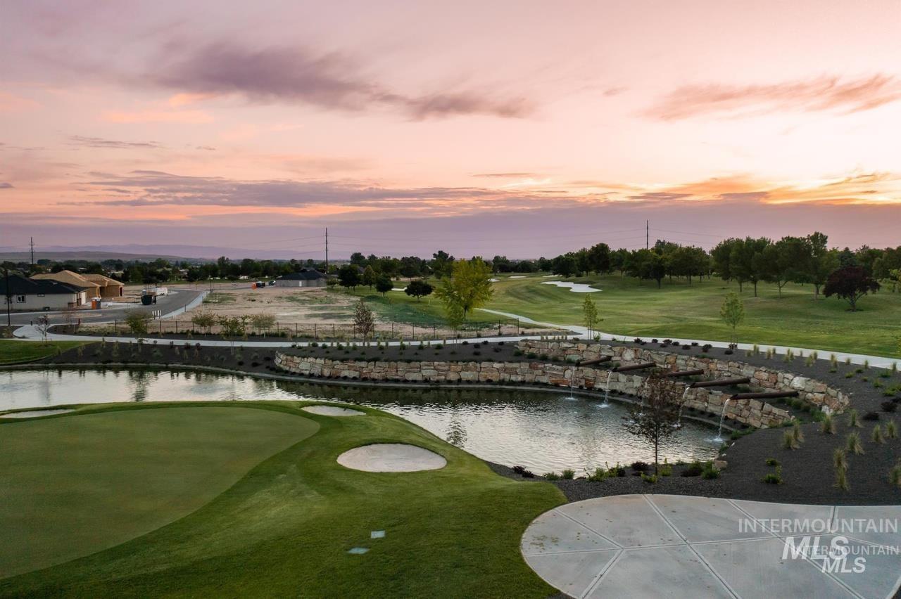 View of property's community featuring a water view and view of golf course