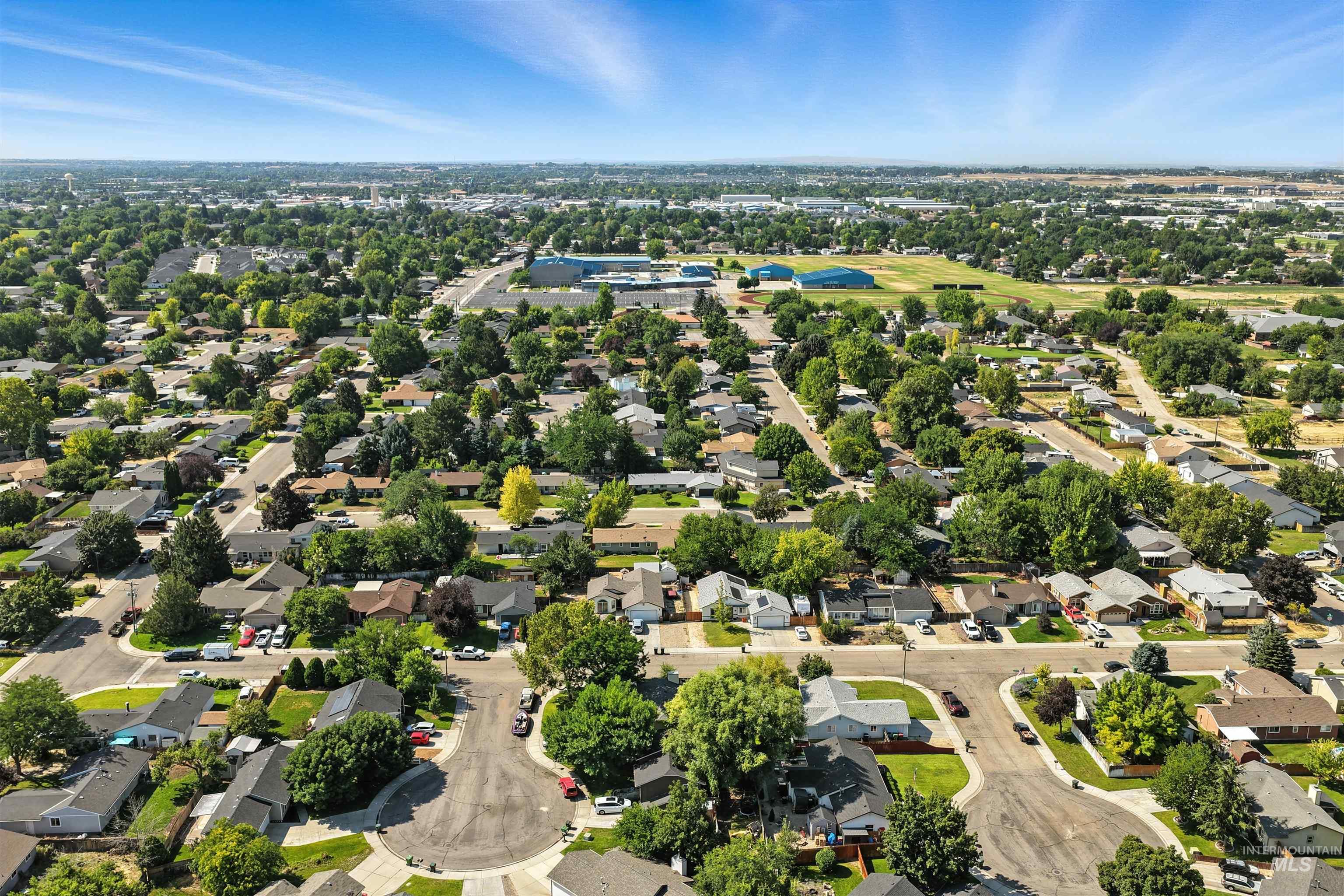 Aerial overview of property's location with nearby suburban area