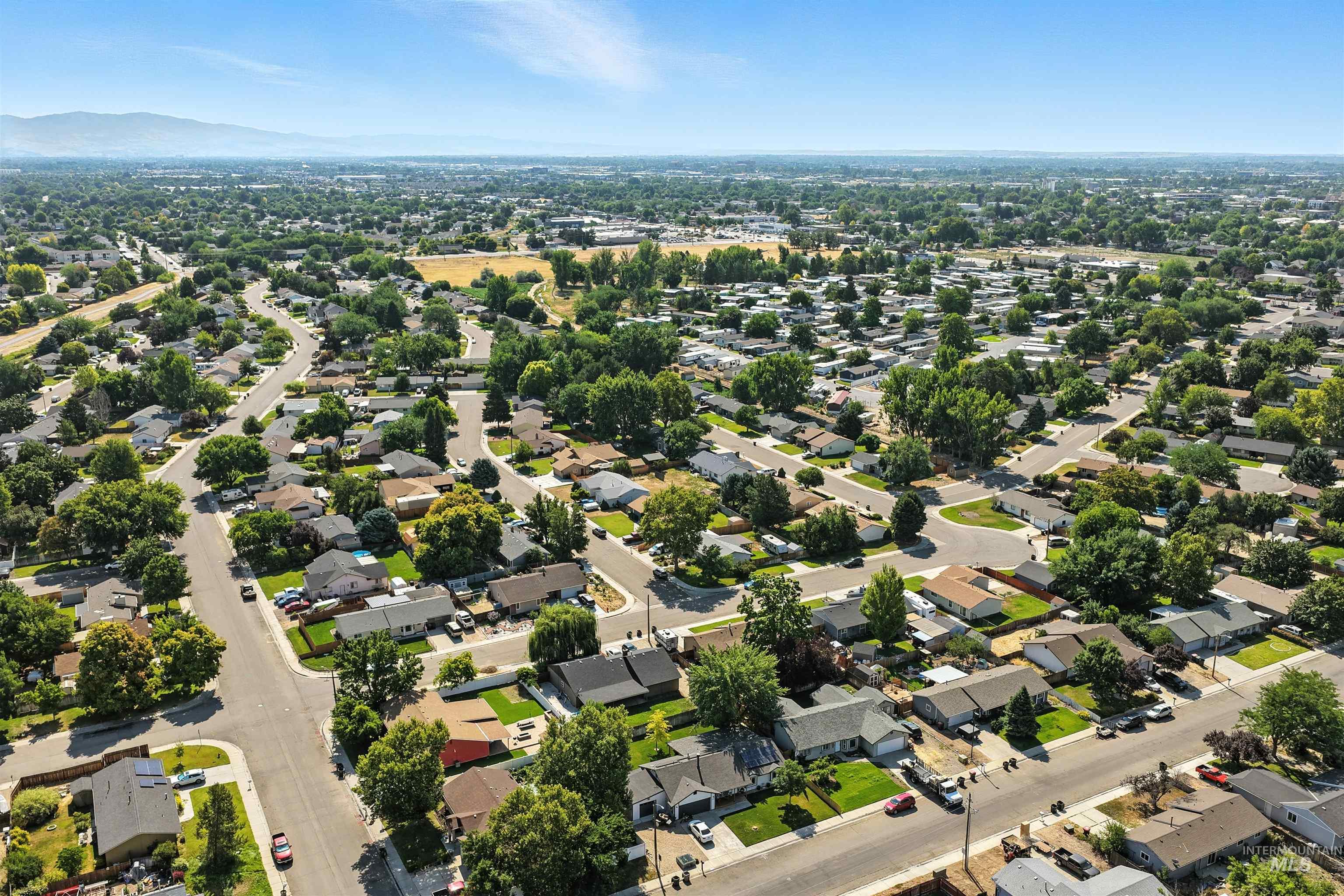 Aerial view of residential area with mountains