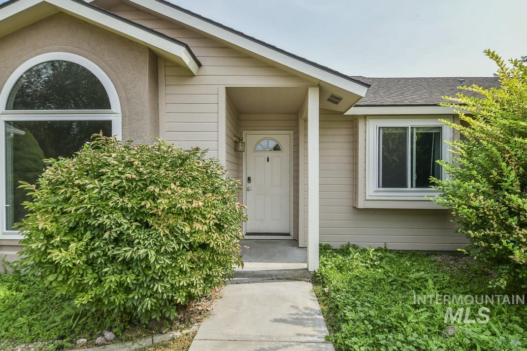 Property entrance with stucco siding