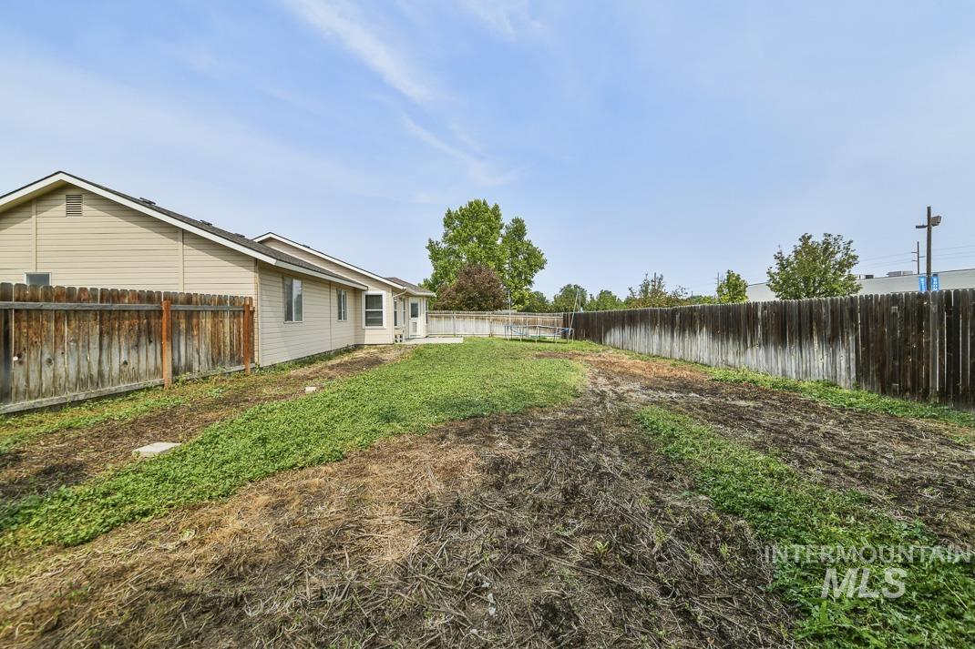 View of fenced backyard