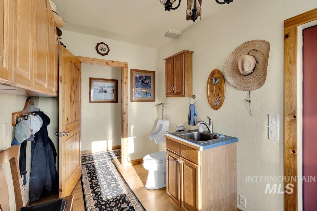 Bathroom with vanity and light wood finished floors
