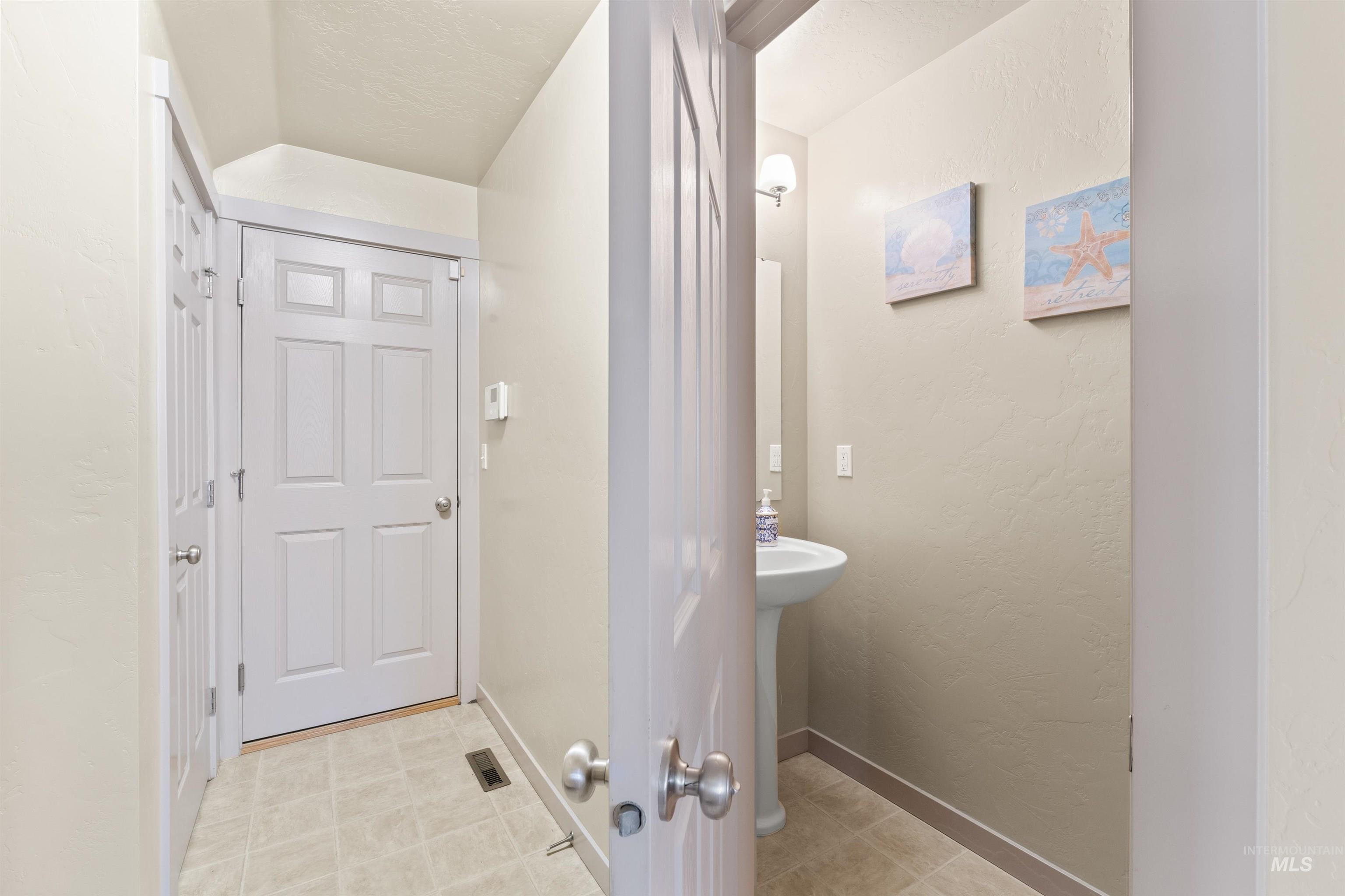 Half bath featuring baseboards