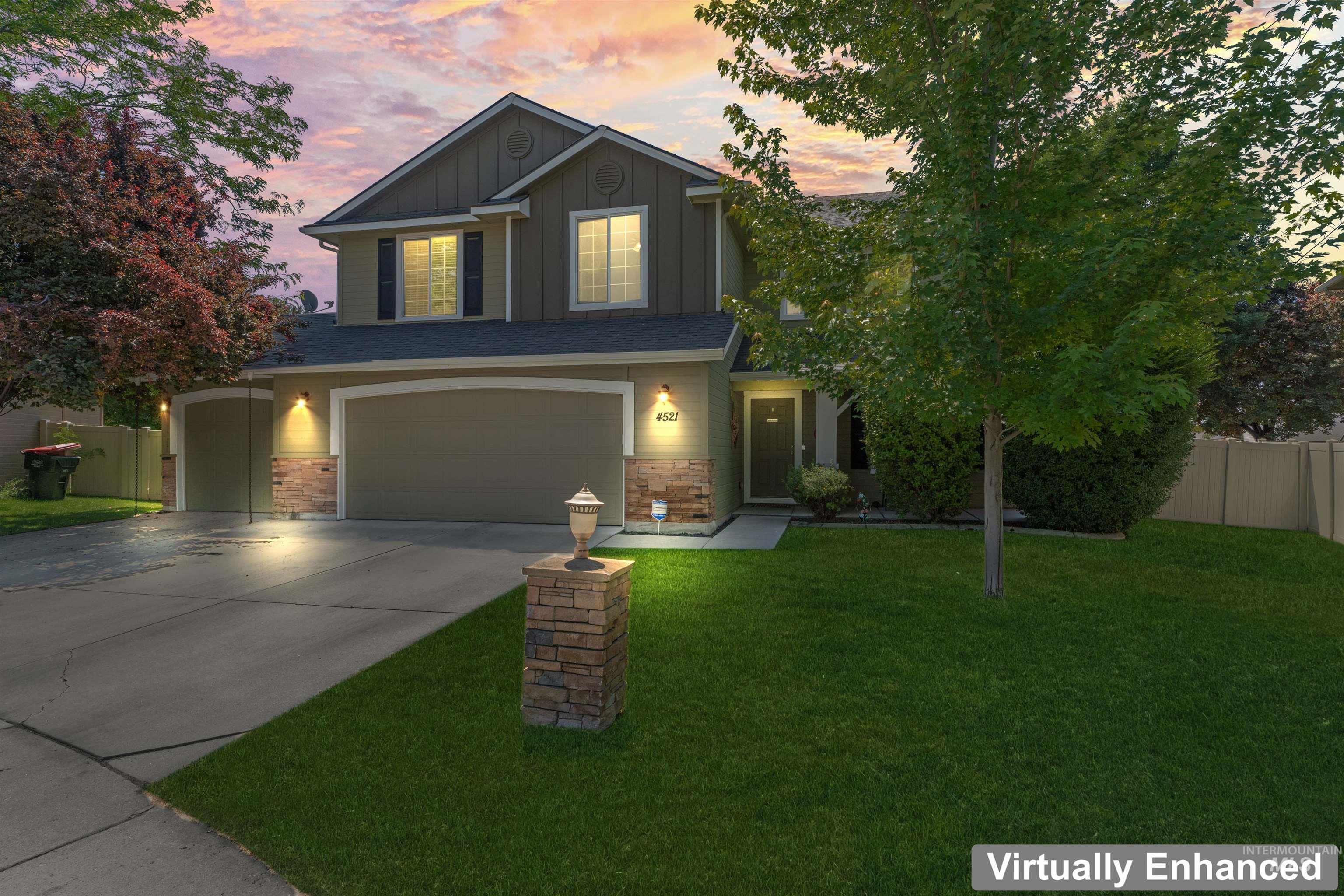 Craftsman house featuring board and batten siding, a garage, and concrete driveway