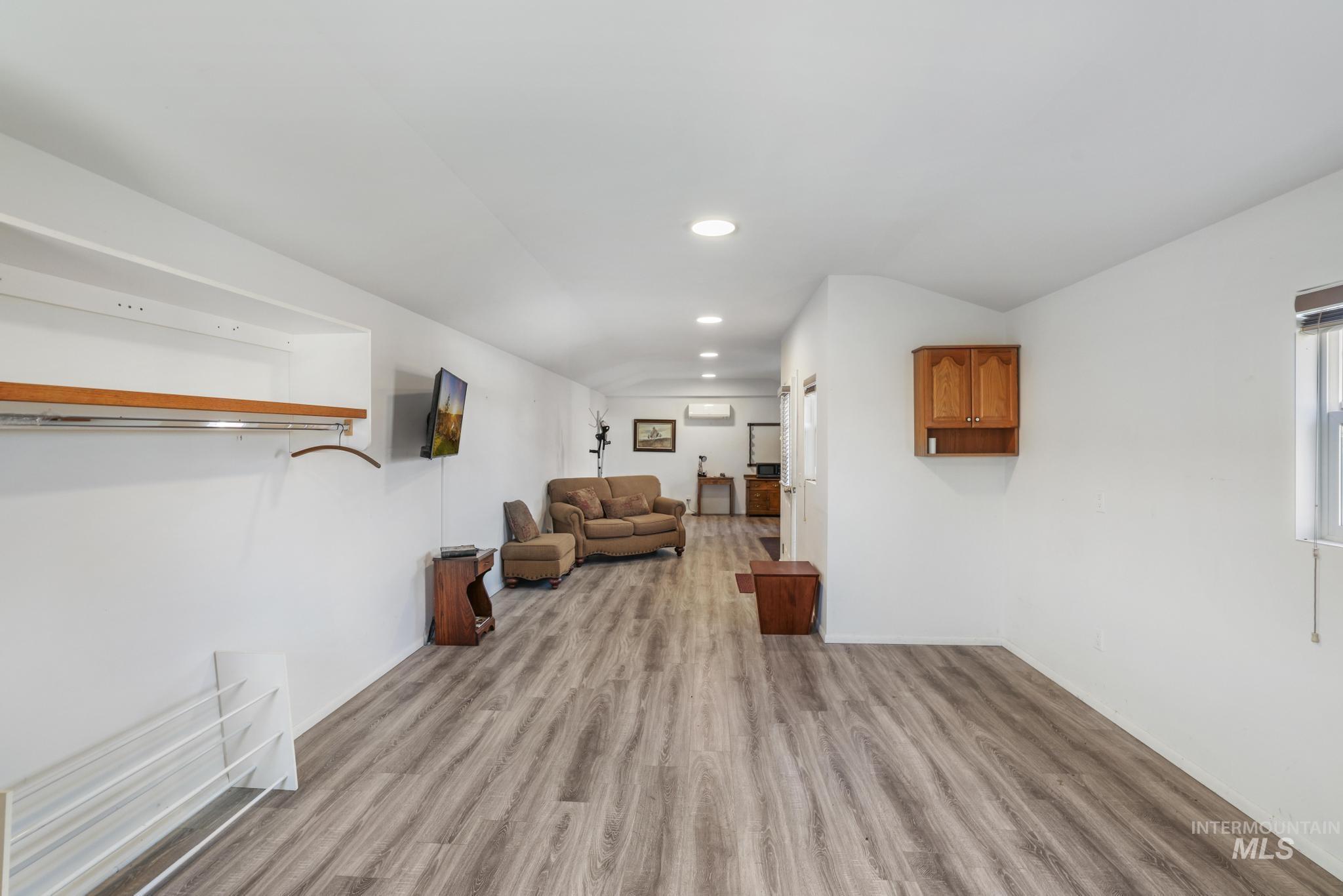 Living area featuring recessed lighting and light wood-style floors