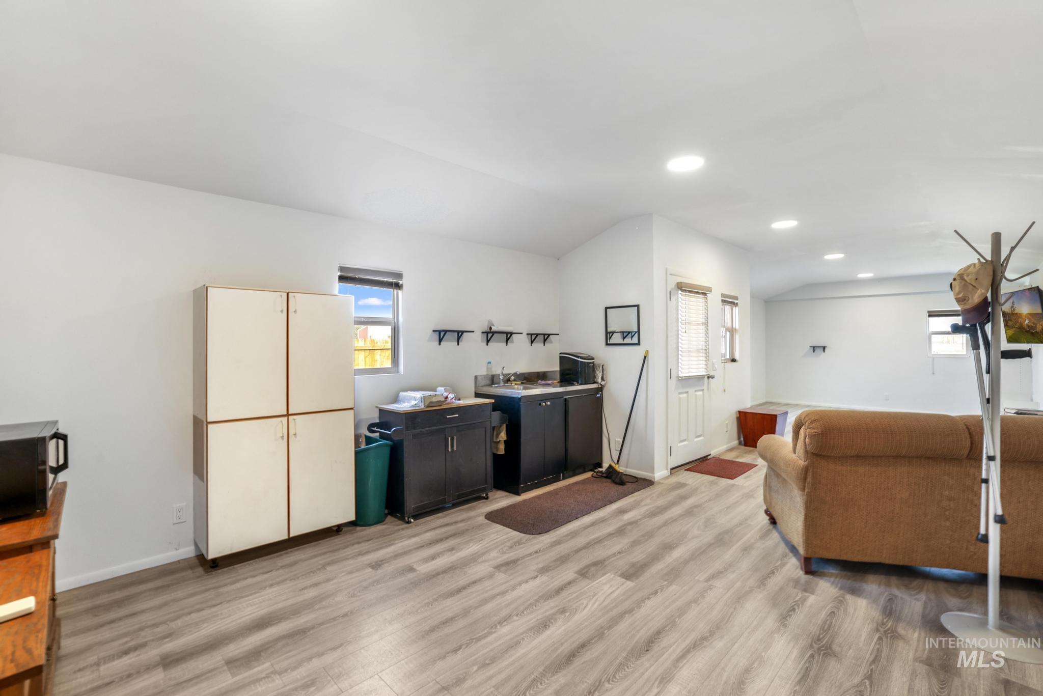 Kitchen featuring light wood-type flooring and recessed lighting