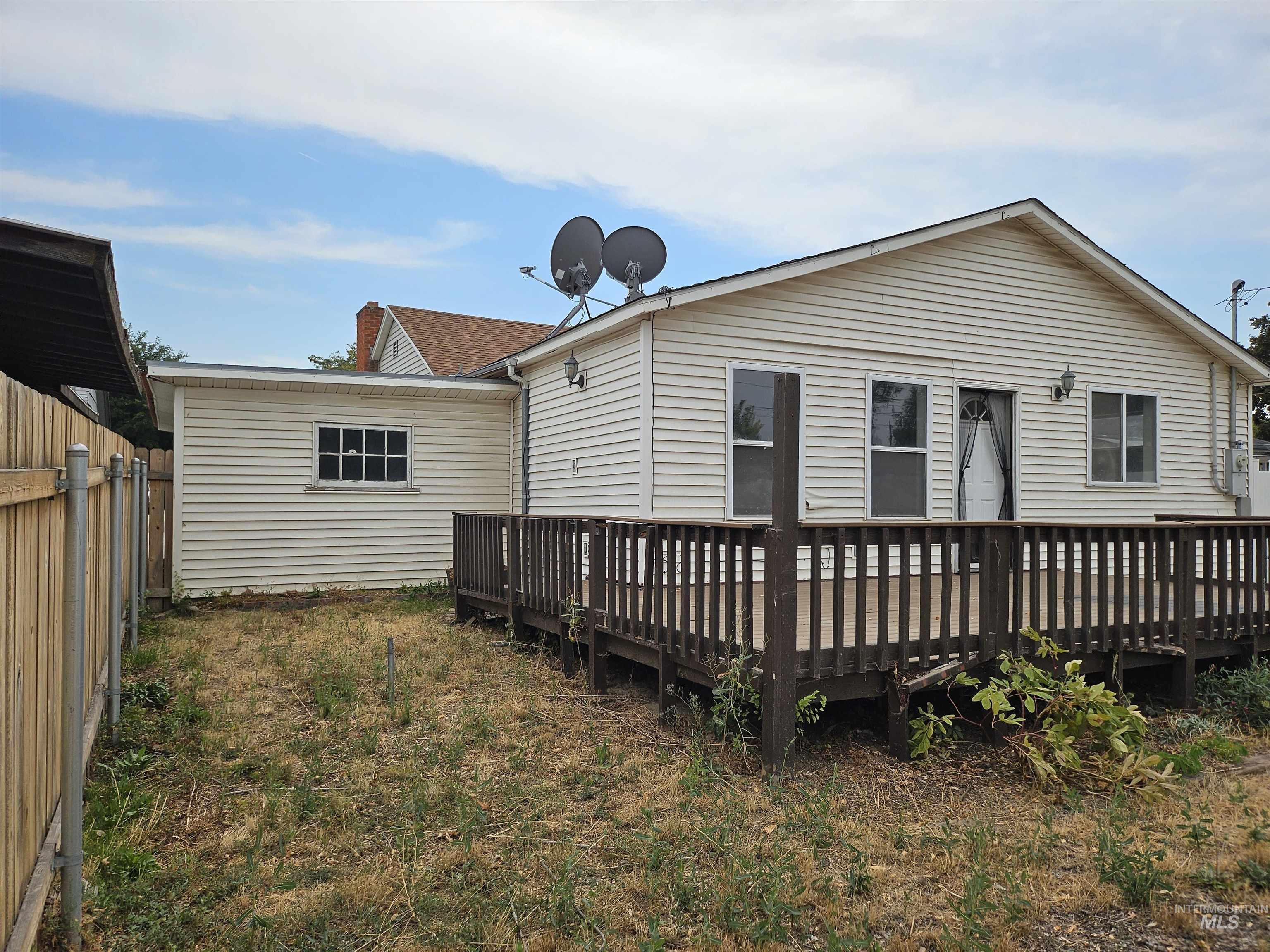 Back of property featuring a deck