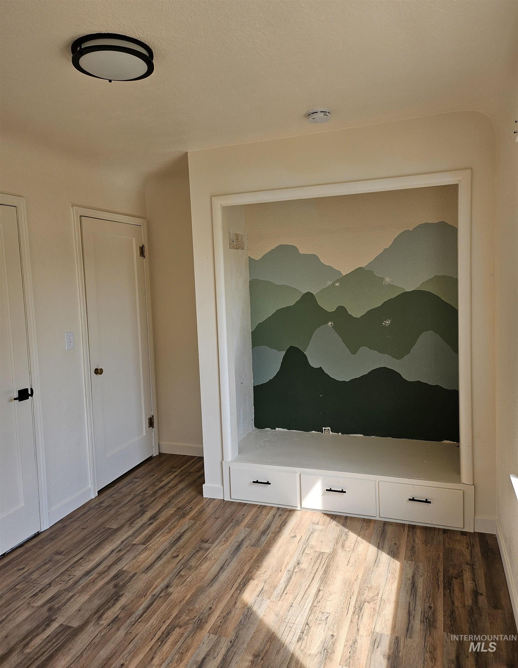 Detailed view of wood finished floors and baseboards