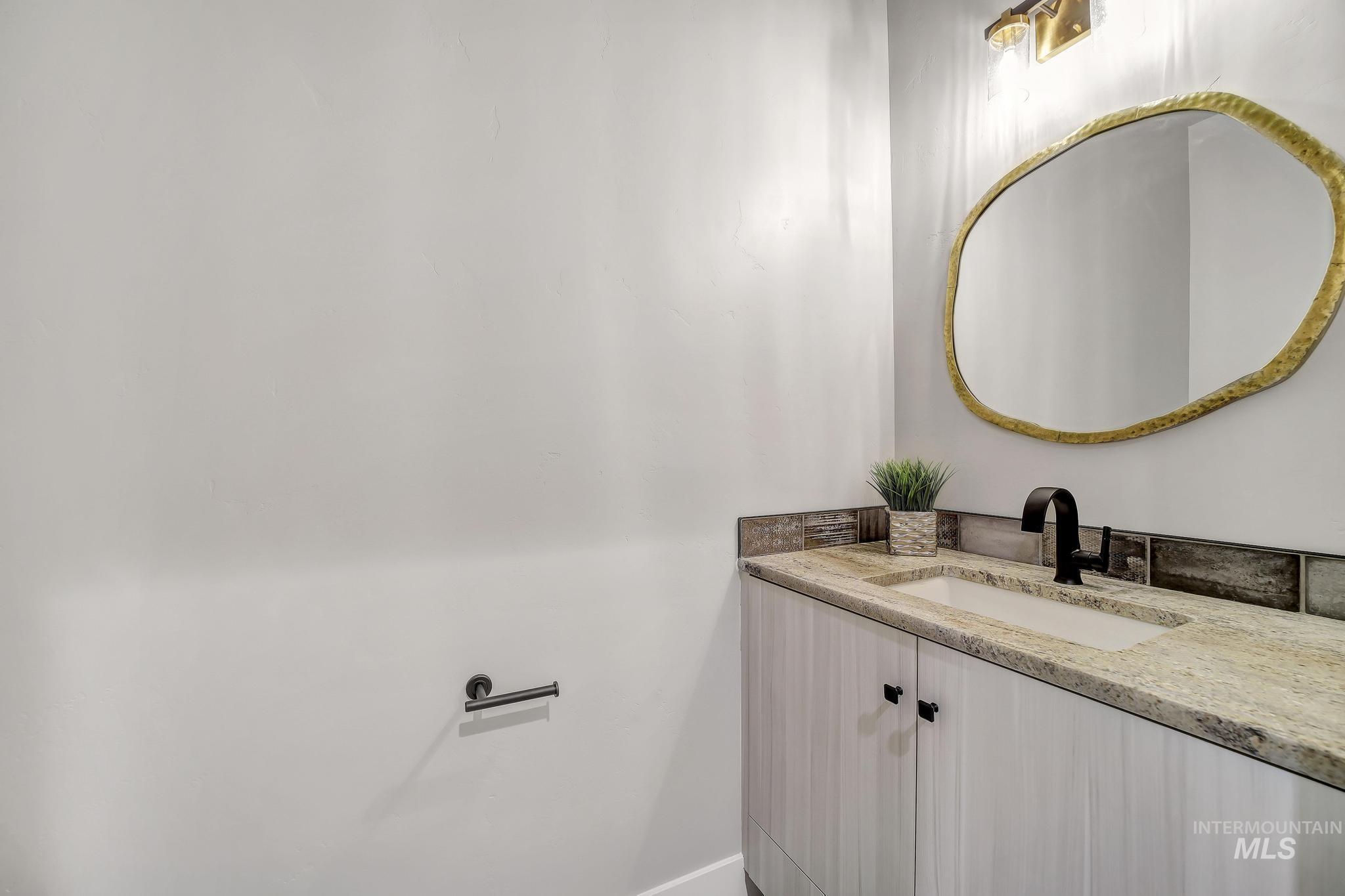 Bathroom featuring vanity and baseboards