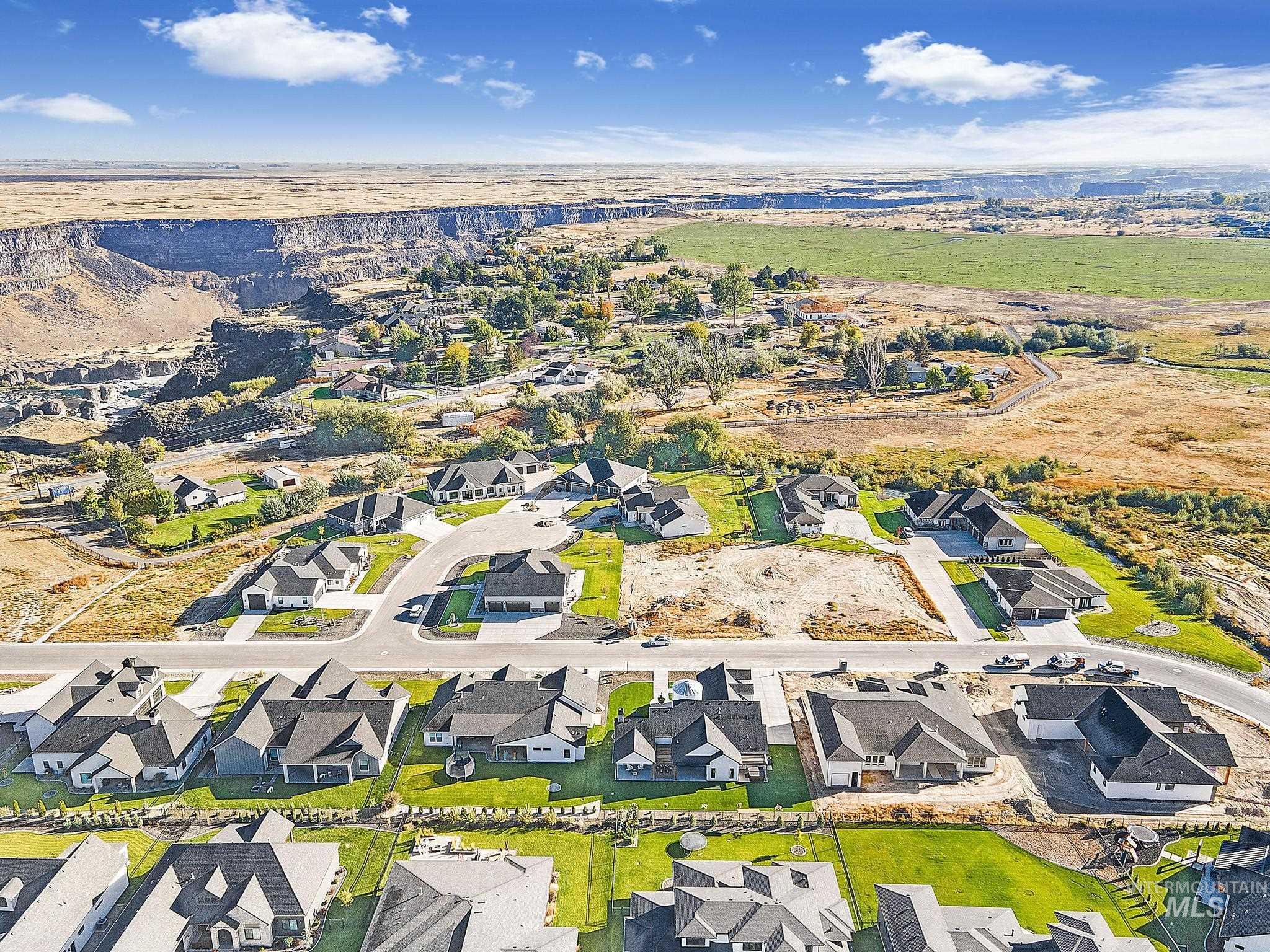 View of property location with nearby suburban area