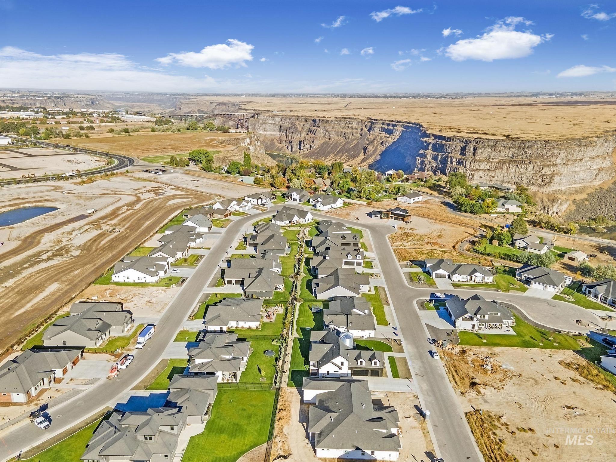 Aerial overview of property's location featuring nearby suburban area